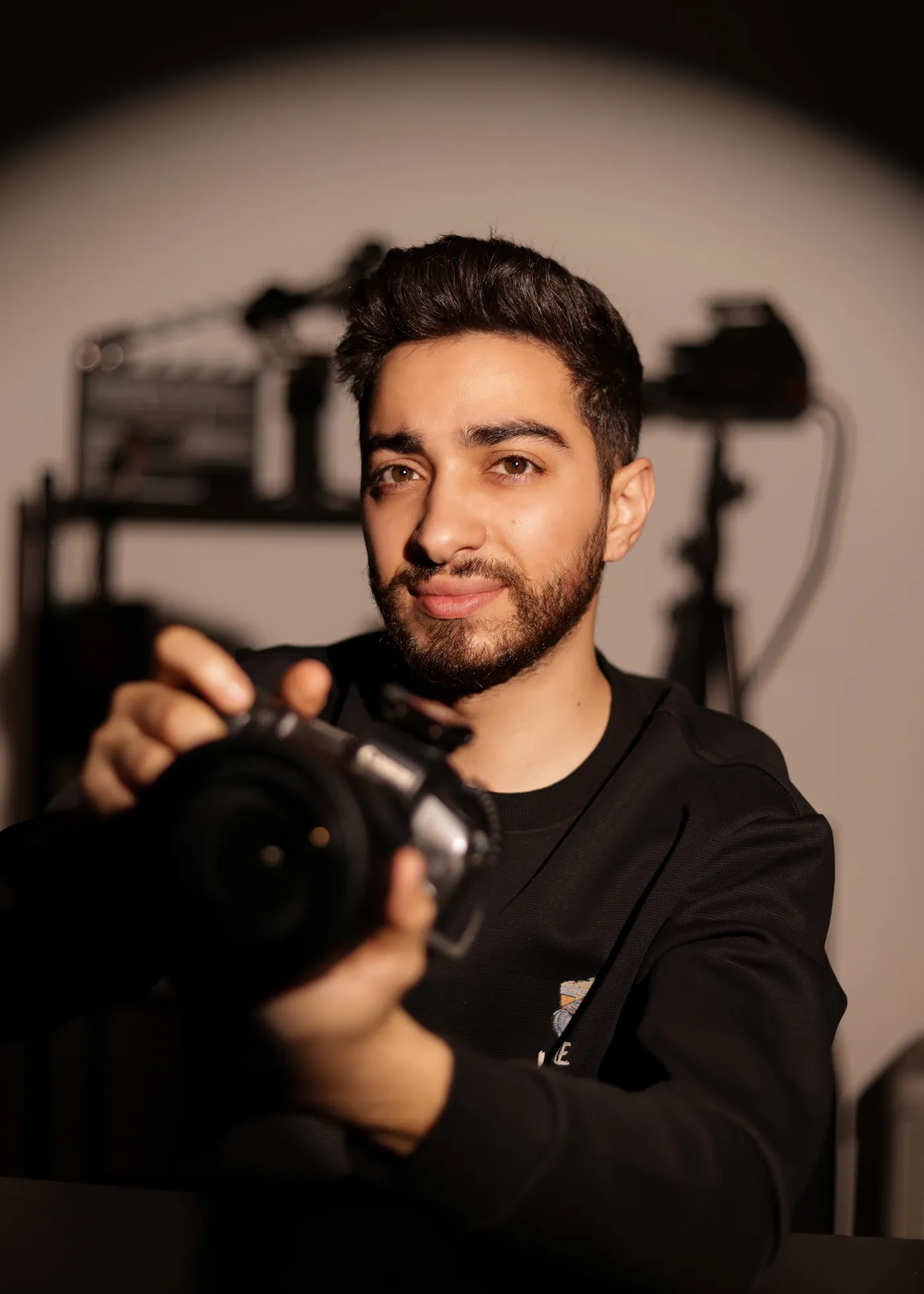 Hady Daaboul, founder of Capo Production, holding a camera